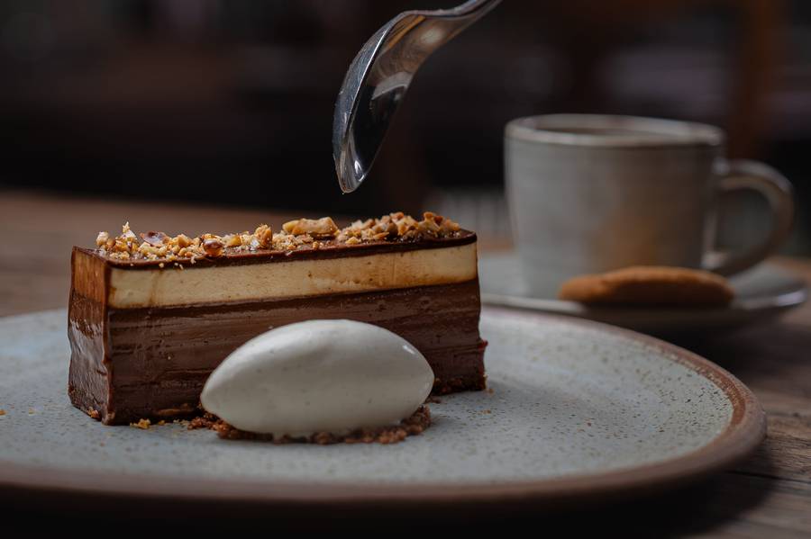Layered chocolate dessert with vanilla ice cream at The Feathered Nest Inn