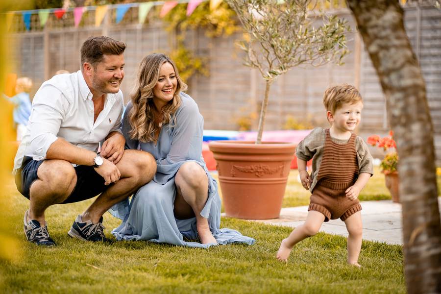 Family celebrating at a garden naming ceremony in the Cotswolds
