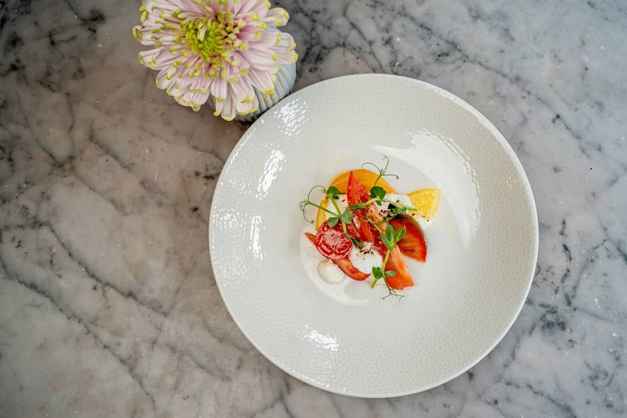 Heritage tomato and burrata starter plated at Hoar Cross Hall